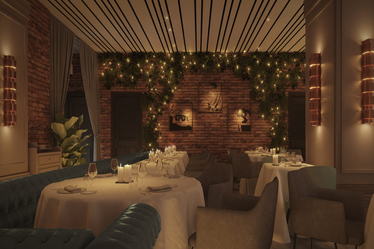 Interior del restaurante Tatel Riyadh decorado con elegancia e iluminado tenuemente en tonos cálidos.